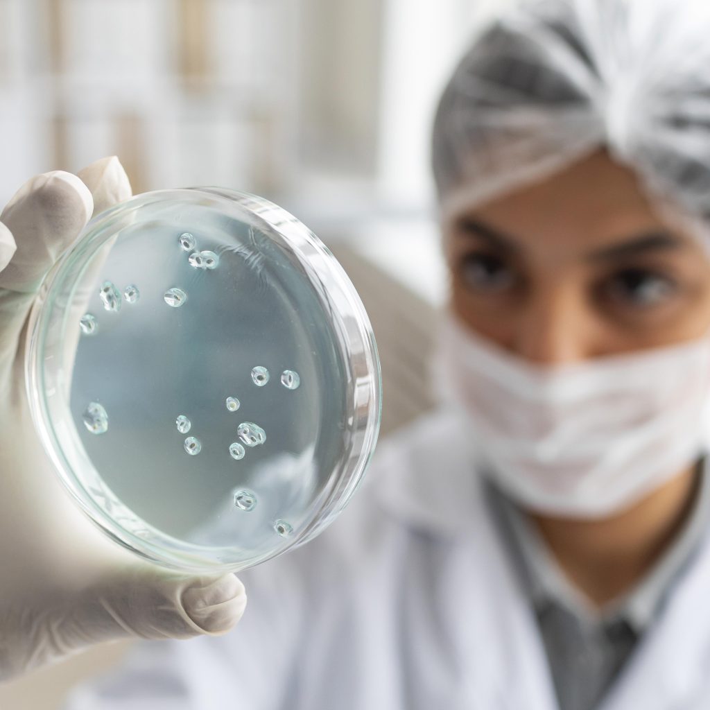 close-up-blurry-scientist-holding-petri-dish (1)